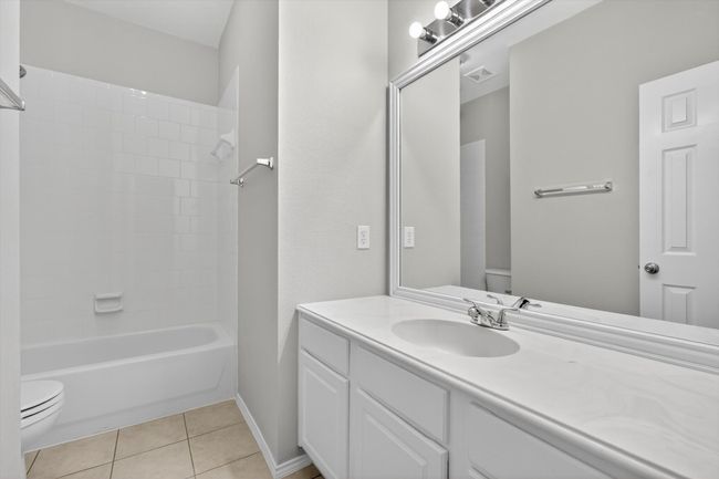 Bathroom featuring tile patterned floors, and bathing tub / shower combination | Image 17