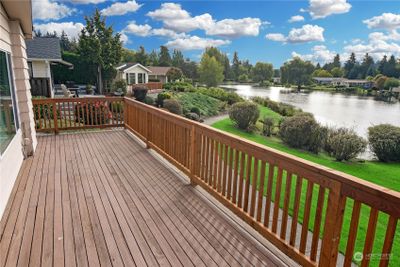 Enjoy this spacious deck overlooking the lake. Walking trails around the lake, fish stocked each year and many activities at the club house and friendly neighbors. | Image 2