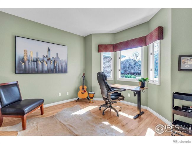 Main floor office features bay window overlooking front yard. | Image 25
