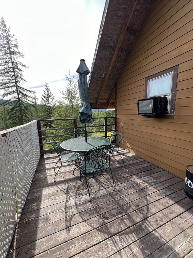 deck with outdoor table & chairs | Image 17
