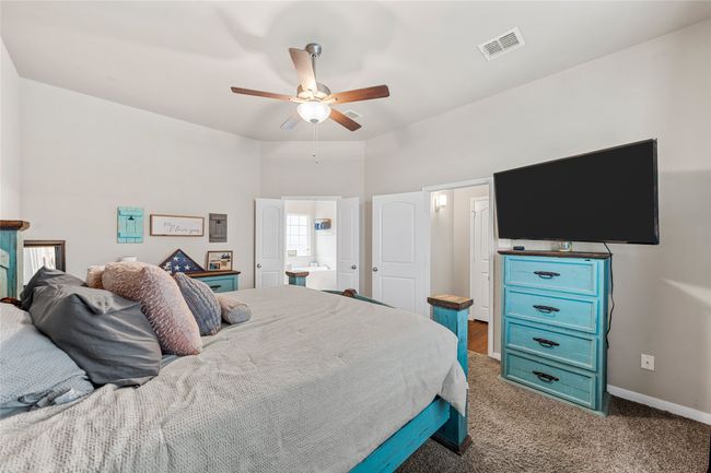 Bedroom with carpet, baseboards, and ceiling fan | Image 20