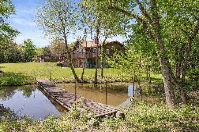 With bridge from 50 amp with water RV spot to main House. Trees that are tagged orange are Cyprus. | Image 24