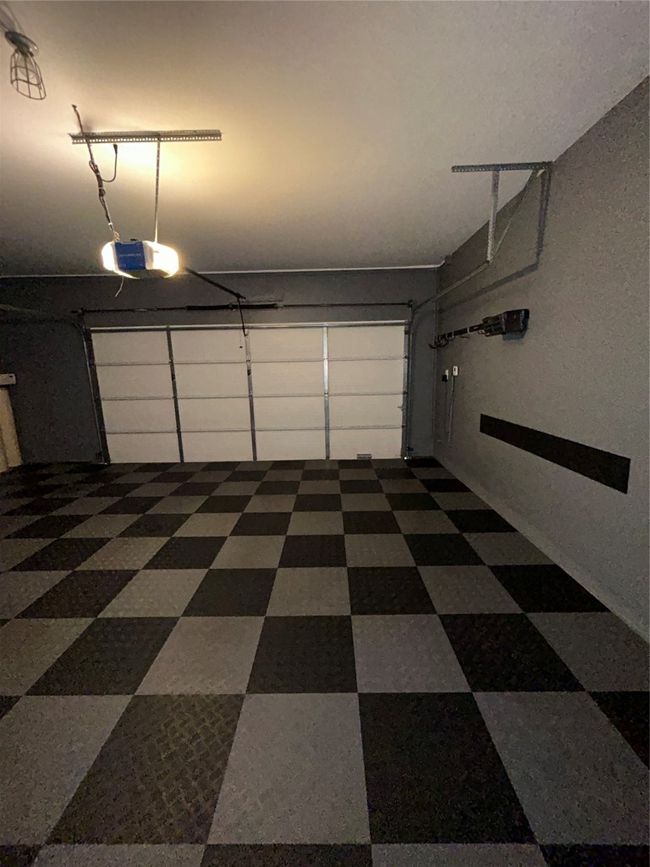 Garage with a garage door opener | Image 18