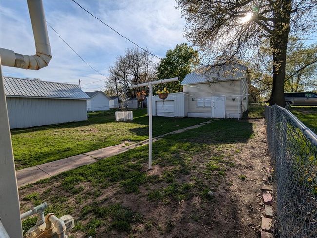 View of yard with fence and an outbuilding | Image 8