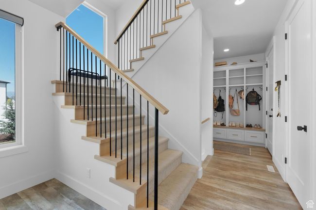 Stairs featuring wood finished floors and recessed lighting | Image 23