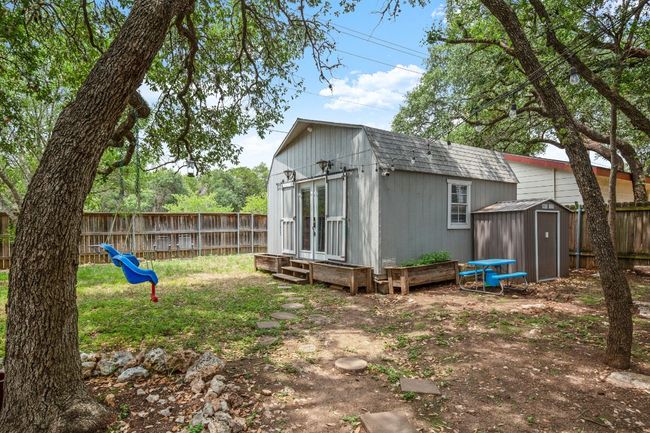 The large trees in the backyard provide a stunning natural backdrop, offering shade and privacy while adding a sense of tranquility and timeless beauty to the space | Image 27