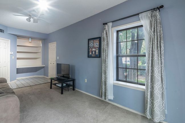 Builtin desk area and additional storage 1st floor bedroom and entry from exterior or interior entry hallwith lots of natural light. | Image 5