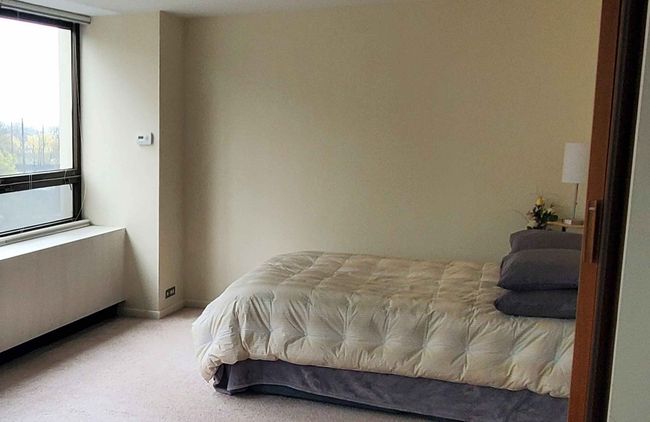 Divider between bedroom & living room fully open w | Image 14