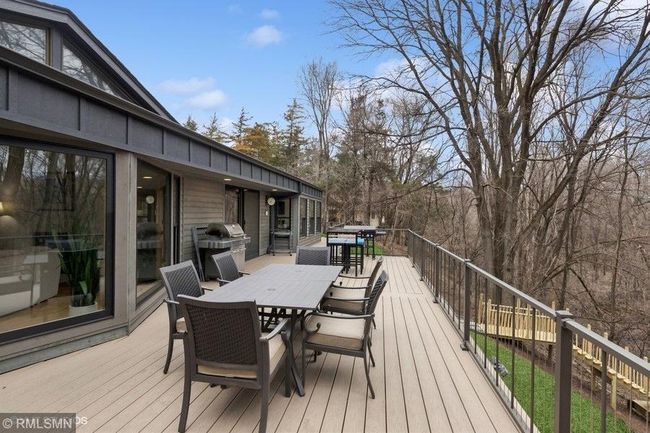 Incredible maintenance free deck that spans the whole backside of the home! | Image 53