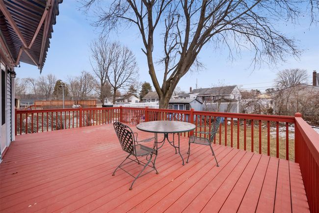 Deck with outdoor dining space and a fenced backyard | Image 35
