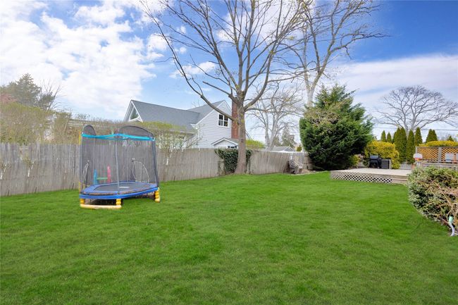 View of yard with fence and a trampoline | Image 20
