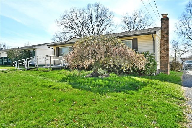 View of front of home featuring a chimney | Image 4