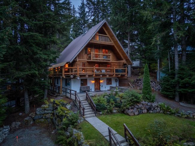 View of front of property with stairs, metal roof, a front lawn, and log siding | Image 6
