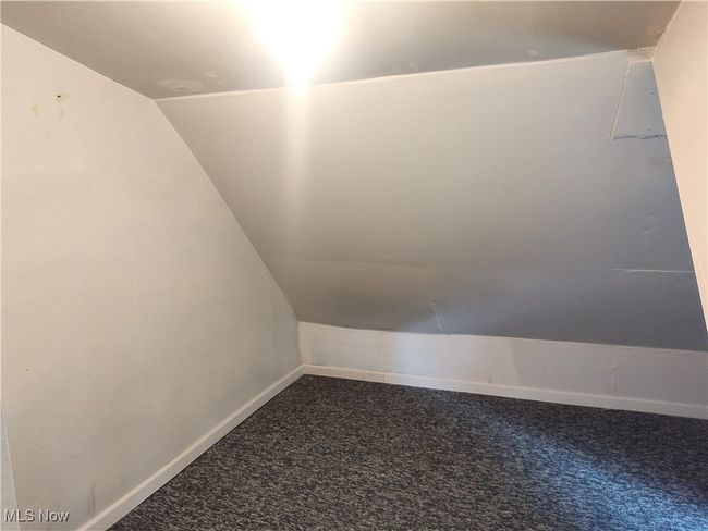 Bonus room featuring carpet flooring, vaulted ceiling, and baseboards | Image 28