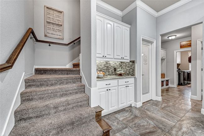Stairs to bonus and attic storage | Image 31