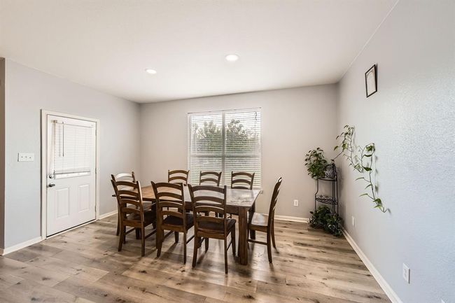 Spacious secondary dining area adjacent to the kitchen. | Image 12