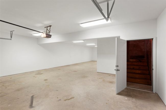 Door opens to a full size walk up staircase to 818 sq ft Man Cave! | Image 30