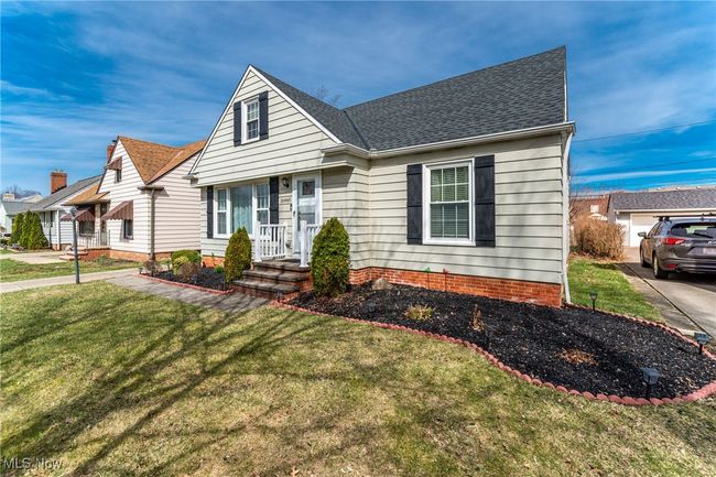 View of front facade with roof with shingles and a front lawn | Image 6
