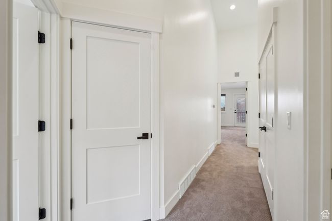 Corridor featuring recessed lighting, visible vents, baseboards, and light colored carpet | Image 34