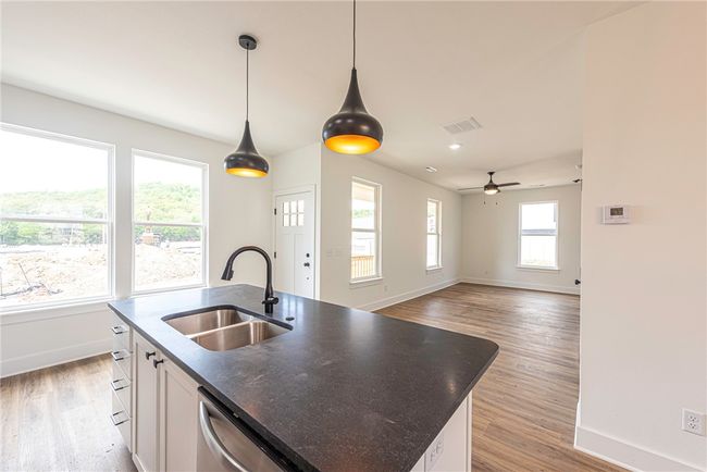 Kitchen overlooking living/dining spaces | Image 6