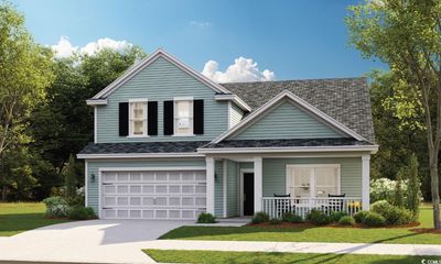 View of front facade featuring a front yard, a porch, and a garage | Image 1