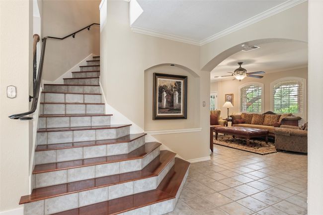 Grand staircase—perfect spot for family photos and welcoming moments | Image 10