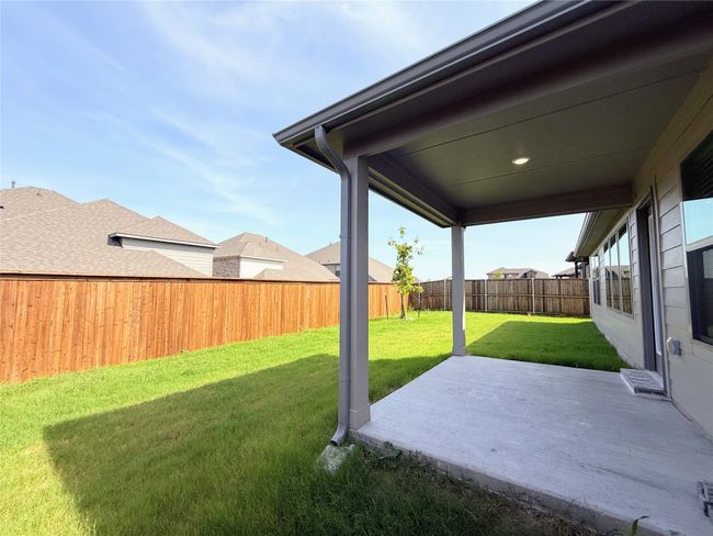 Fenced backyard featuring a patio area | Image 32