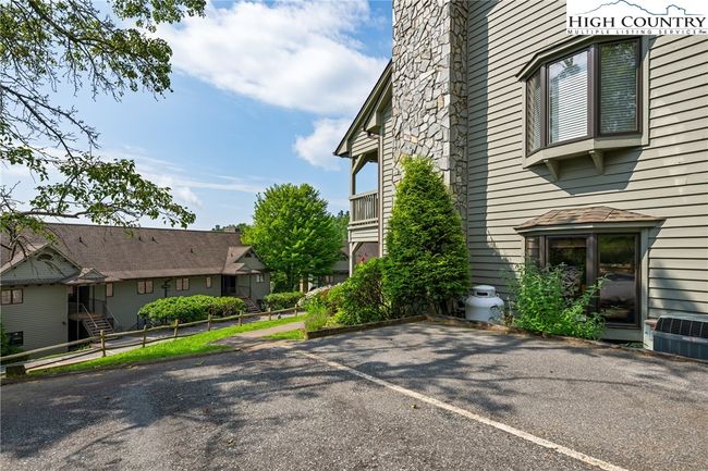 Parking space next to the unit with stairless walkway to the back patio | Image 33