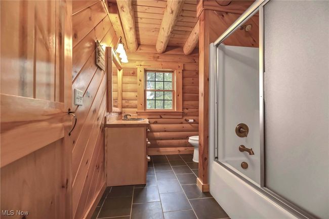 First floor guest bath with tile floors, tub/shower combination | Image 14