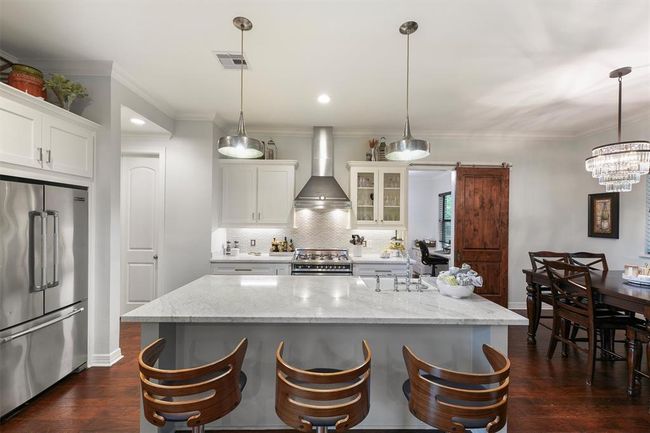 Stainless steel appliances and Carrara marble countertops | Image 6