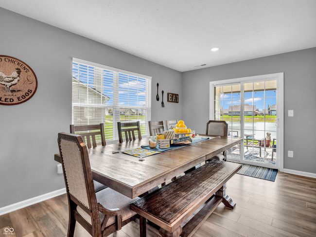 dining room featuring wood finished floors, recessed lighting, visible vents, and baseboards | Image 11