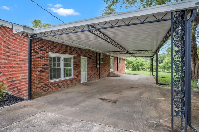 ADJOINING COVERED PATIO. PERFECT FOR SUMMER BBQ'S EVEN WHEN IT'S RAINING. | Image 7