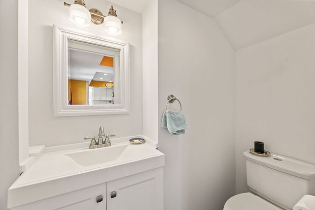 Bathroom featuring toilet and vanity | Image 15