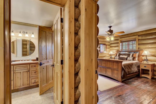 Bedroom with rustic walls and a sink | Image 16