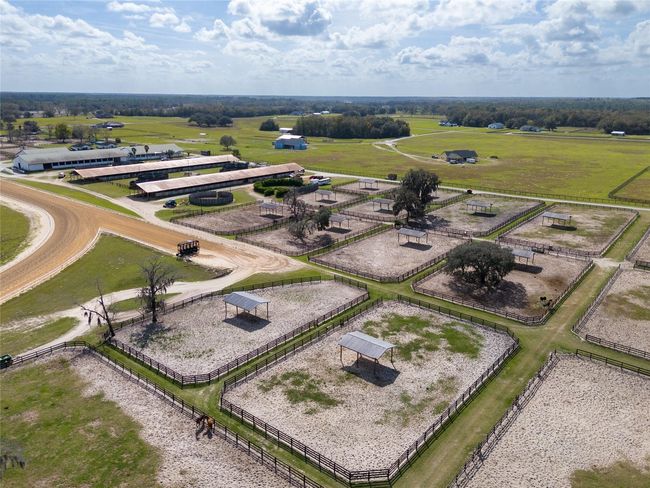 More paddocks and view of three barns with 120 stalls total | Image 12