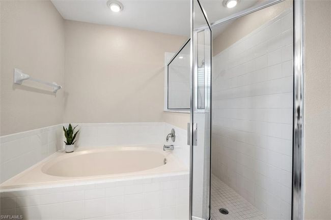 Full bath featuring a bath and a shower stall | Image 25