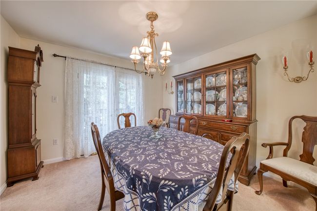 Large dining room which leads to the screened in sun porch | Image 10