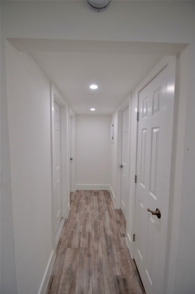 Hall featuring wood finished floors and recessed lighting | Image 11