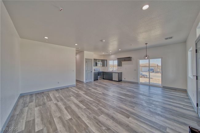 Bright and open living room in the Laila Floor Plan, designed for comfort and versatility. **These are model photos, light fixtures subject to change.** | Image 4