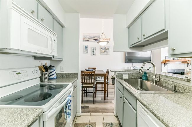 Entertain guests while you're cooking in the kitchen. | Image 12