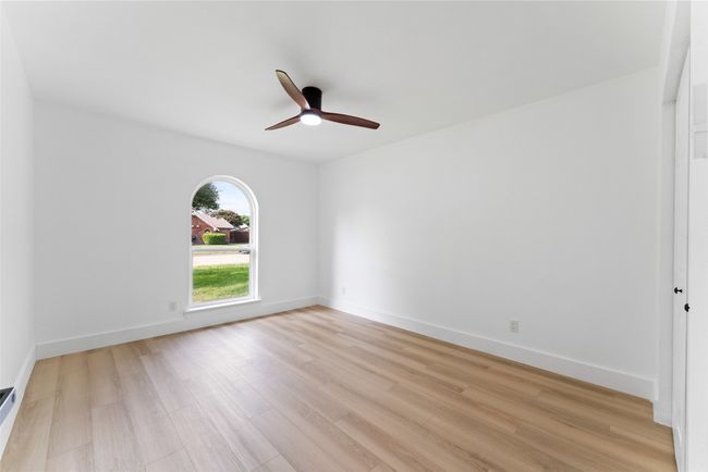 Spare room with light wood finished floors and ceiling fan | Image 16
