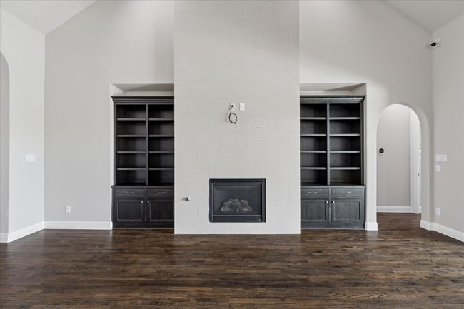 Built-ins surround the fireplace with room for a mounted TV | Image 9