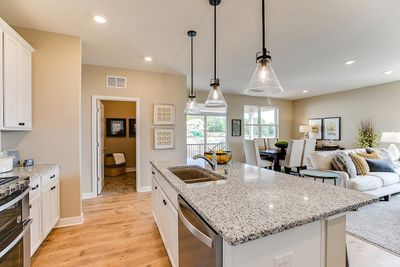 Kitchen has ample counter space (including seating at the island!) and lots of cabinet space. The perfect space for making everyday meals or memorable special occasion dinners. *Photo of previous model. Actual home may vary. | Image 3