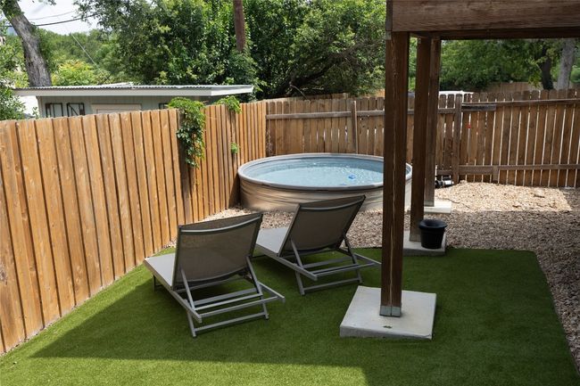 View of yard featuring a stock tank pool | Image 37