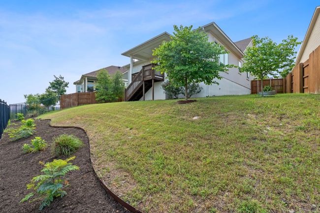 The backyard also boasts beautiful, well-maintained landscaping and comes ready for your immediate enjoyment. | Image 32