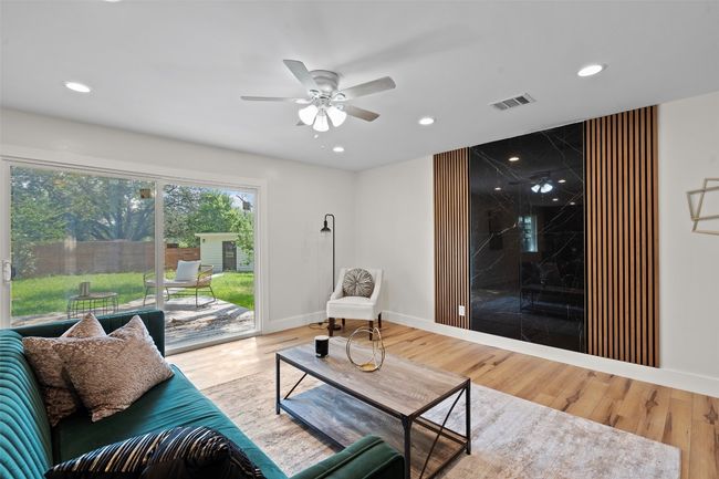 Living room featuring a ceiling fan, recessed lighting, wood finished floors, and baseboards | Image 5