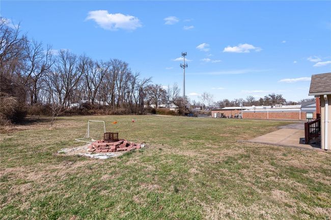 View of yard with a fire pit | Image 32