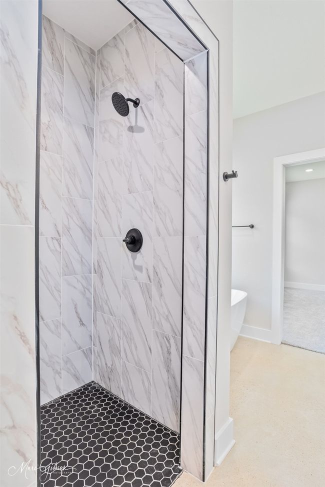 Full bath with a freestanding bath and tiled shower | Image 12