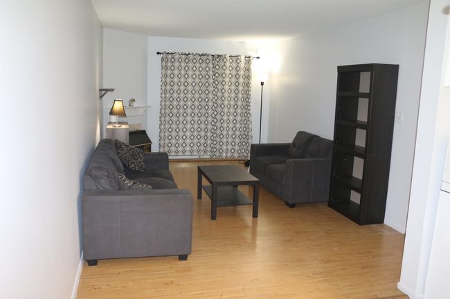 Living room with light wood finished floors | Image 9