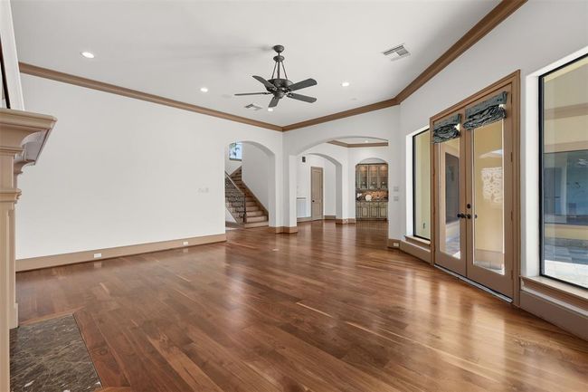 The high ceilings and the cascade of natural light through tall windows highlight the spaciousness of this home. | Image 14